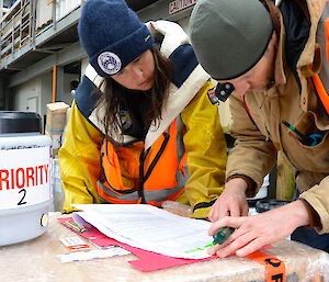 Andrea and Mark checking the cargo manifest