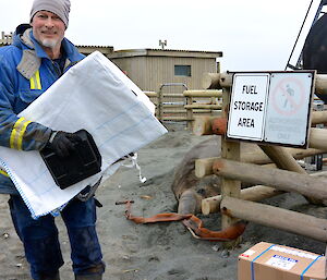 Nick at the fuel farm being watched by an elephant seal