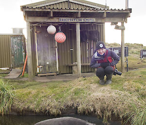 Helena with a seal outside of Bauer Bay hut