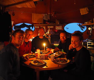 Dinner party at Brother’s Point hut. Robbie, Terry, Rich, Jimmy, Helena