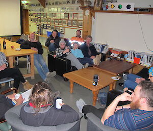 Expeditioners sitting in mess having a briefing