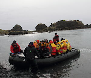 Group of expeditioners in inflatable boat