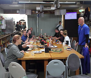 Dinner table in mess with expeditioners sitting talking