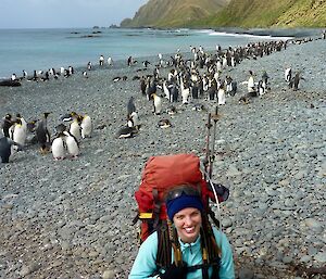Helena on Sandy Bay beach with King Penguins to the rear