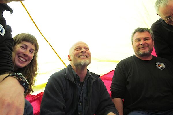 Expeditioners in tent like structure