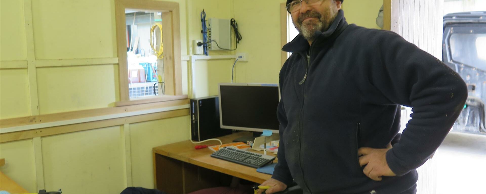 Dom standing in front of workstation