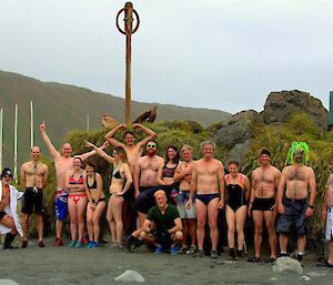 2016 Australia Day swimmers standing in front of anchor rock and Australian flag