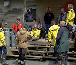 Expeditioners on front steps of the mess