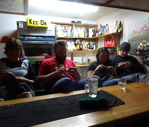 Expeditioners at the bar knitting and crocheting