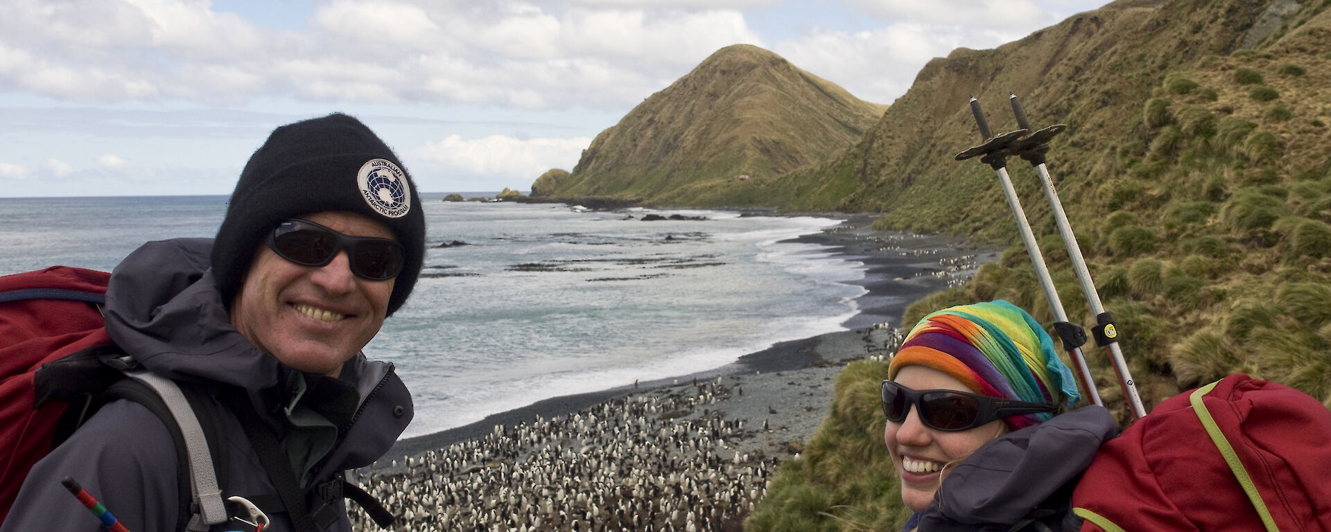 Terry out enjoying the Macca wildlife with Helena, a beach with penguins is behind them