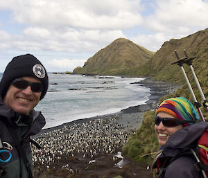 Terry out enjoying the Macca wildlife with Helena, a beach with penguins is behind them