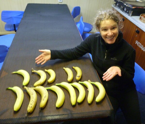 Anna looking at bananas on the cruise ship