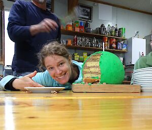 Anna and a cake that looks like a giant pea