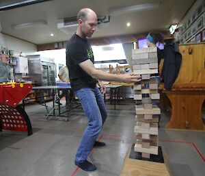 Jeremy R taking on the Giant Jenga challenge