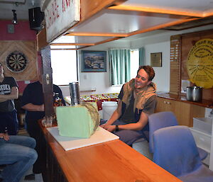 Tim sitting at the bar with his birthday cake