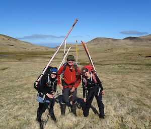 Three rangers on a sunny plateau day