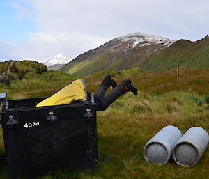 Expeditioner looking in a hut pod