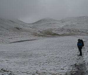 Expeditioner Rowena standing in a snowy landscape