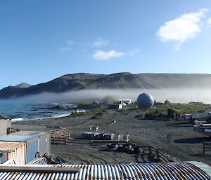 View to the plateau from station of low lying fog and blue sky