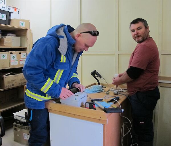 Rich and Rob working at a desk