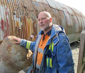 Nick C standing beside nissan hut