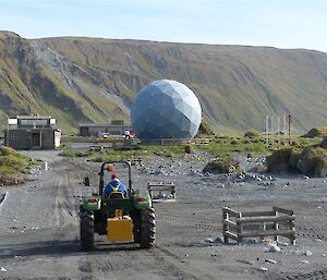 Duncan driving across the isthmus in a tractor