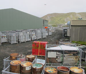 Cage pallets stacked behind the green store