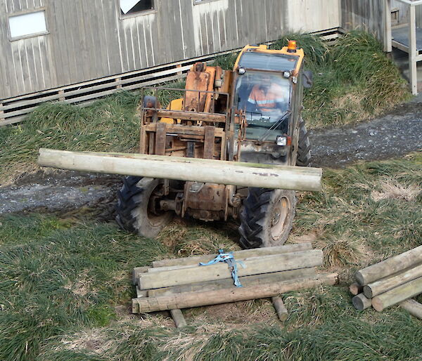 JCB moving logs