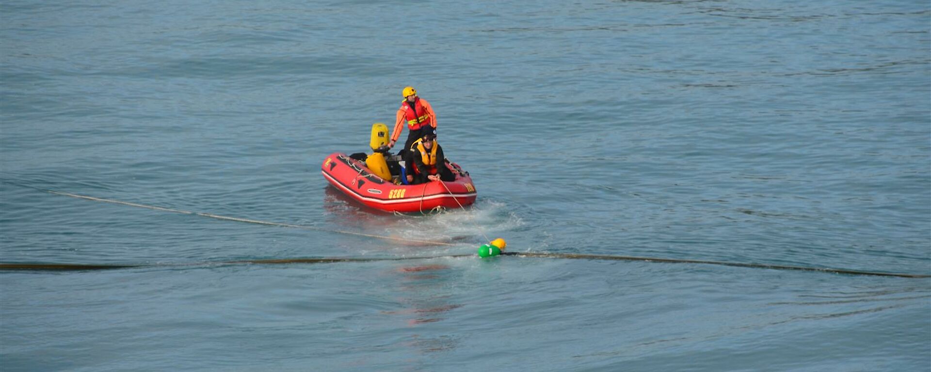 IRB team on the water tending the fuel line