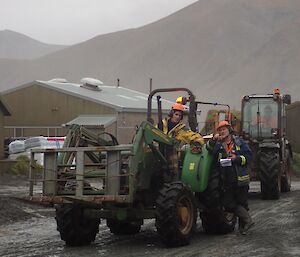 Tim on tractor talking to Nick to plan the next tractor load as part of resupply