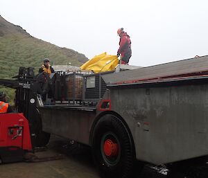 A LARC being unloaded directly at the Green Store. As Amphibious vehicles they can travel from the ship straight to where they need to be on land.