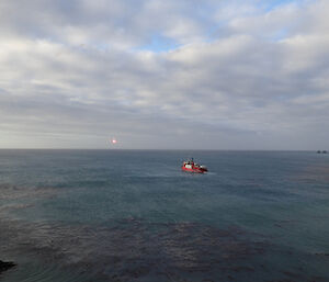 L'Astrolabe heading off for the horizon with flares sparks in shot