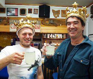 Marcus and Marty in their blow-up birthday crowns and with full glasses for a toast.