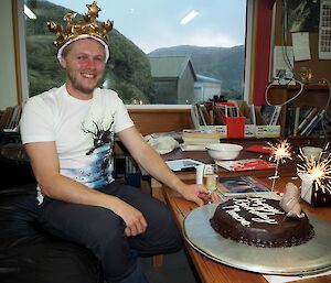 Marcus with his chocolate mud birthday cake with sparklers.