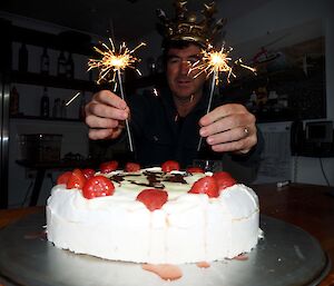Marty with his birthday pavlova and sparklers
