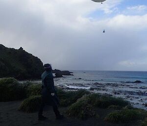 A woman launches her balloon over the bay