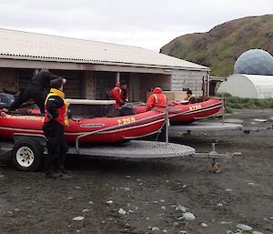 Team all dressed in their dry suits with boats on trailers ready to go