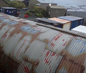 A high shot of the old roof from the MPB — various holes clearly visible