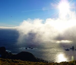 Blue sky over the coastline at the southern end of the island