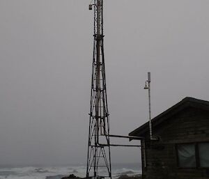 A large mast outside the building with the air sampler