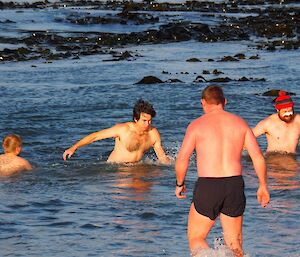 Men in the water at Buckles Bay