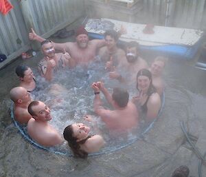 A group of people crammed into a steamy spa
