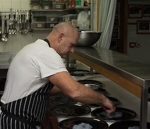 A chef plating up food