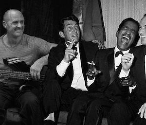 B&W photo of 4 men