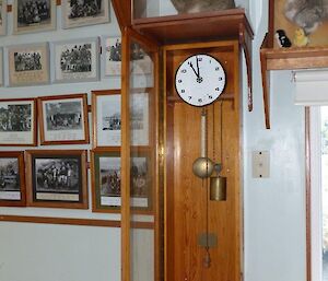 An old wooden pendulum clock.