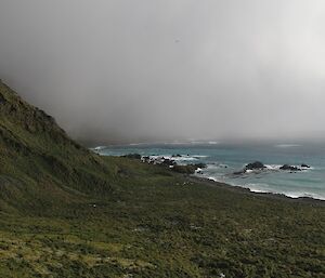 A view of the coast with clouds coming towards the camera