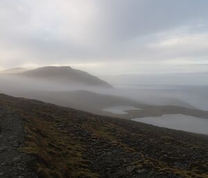 A shot of the coast looking into the mist of the distance