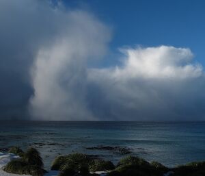 A dramatic cloud formation over the water