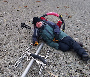 A man on the ground next to the antenna