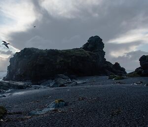 Rock on coast with clouds